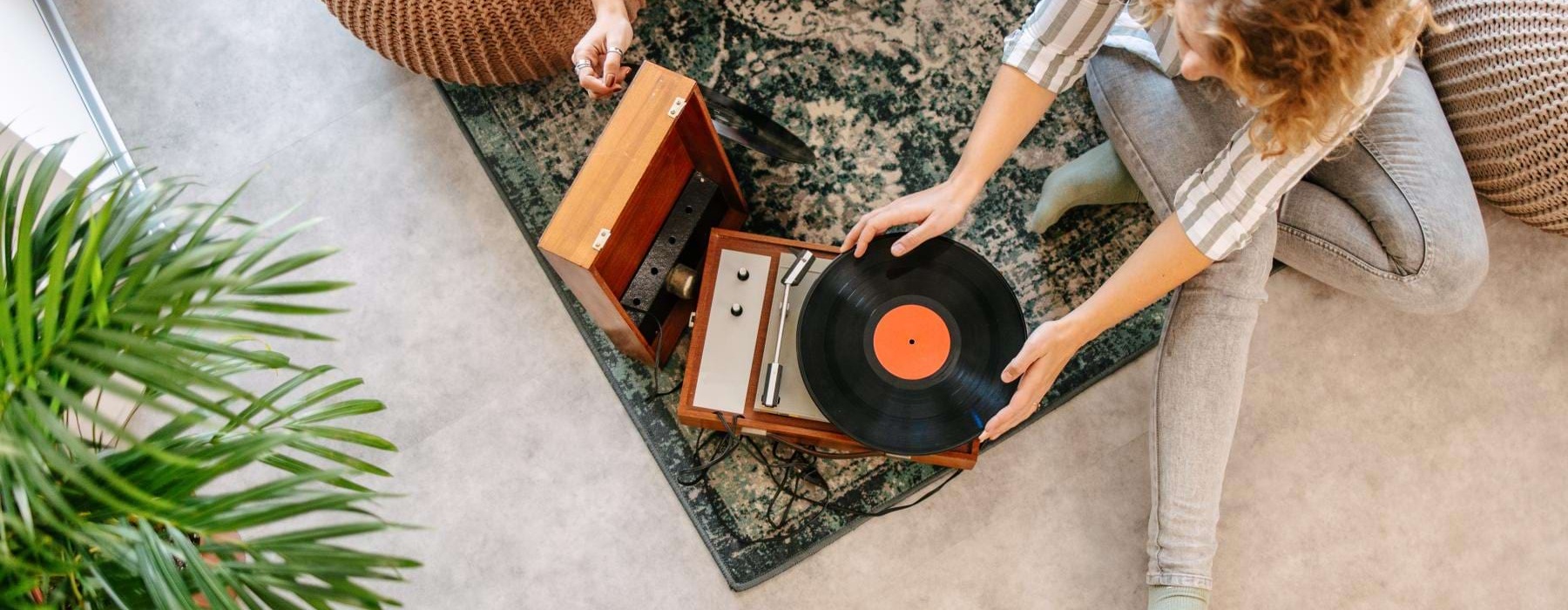 two people looking at vinyls