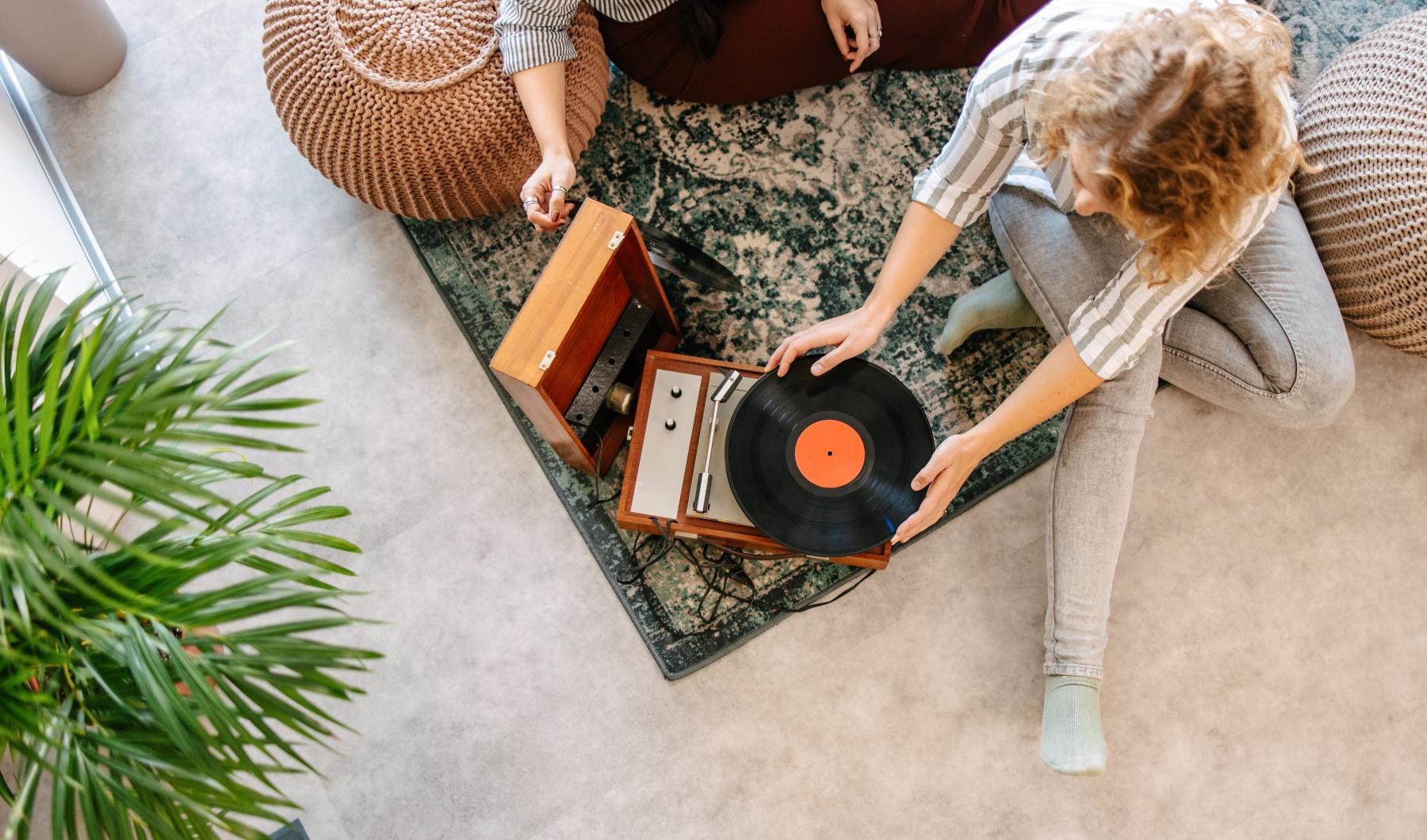 two people looking at vinyls