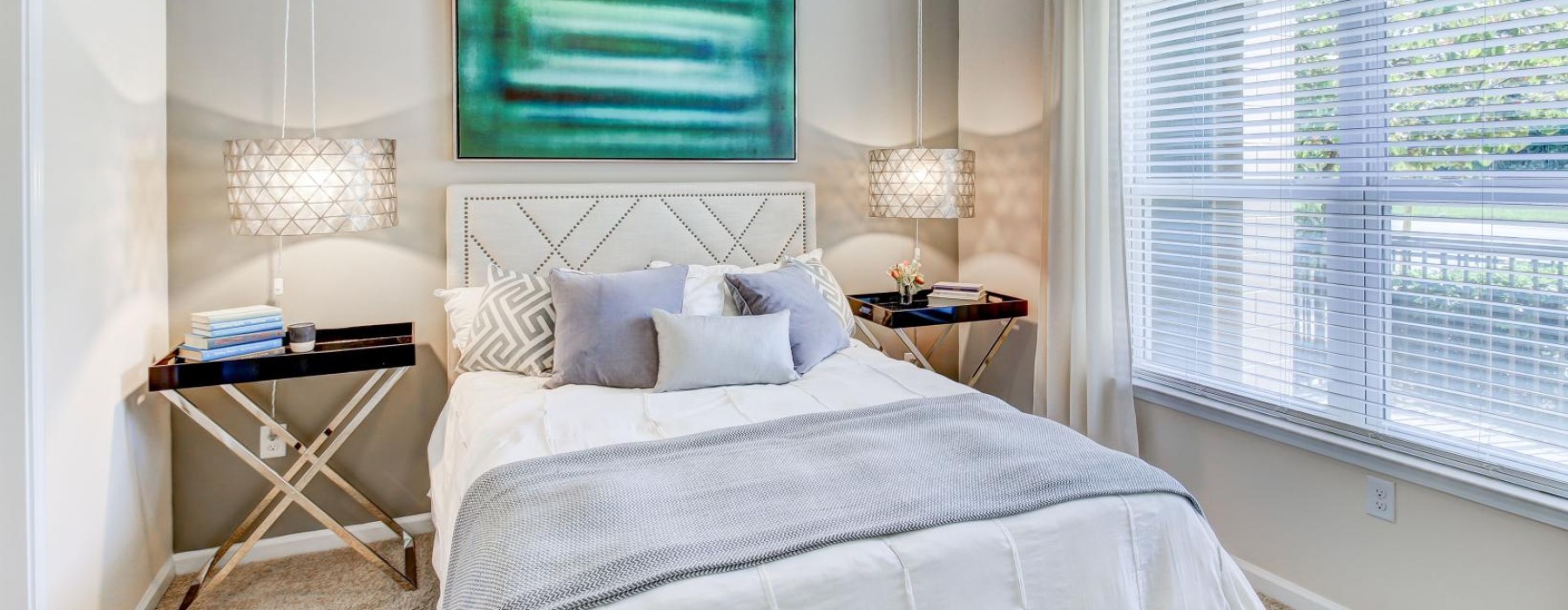 a bedroom with a bed and a table