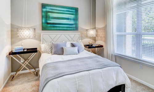 a bedroom with a bed and a table