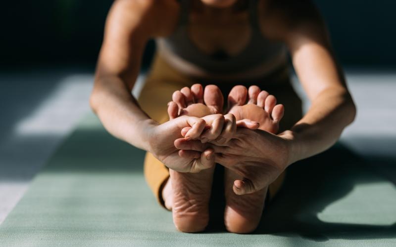 a person stretching on a mat