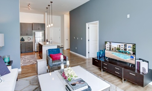 a living room with a tv and couches